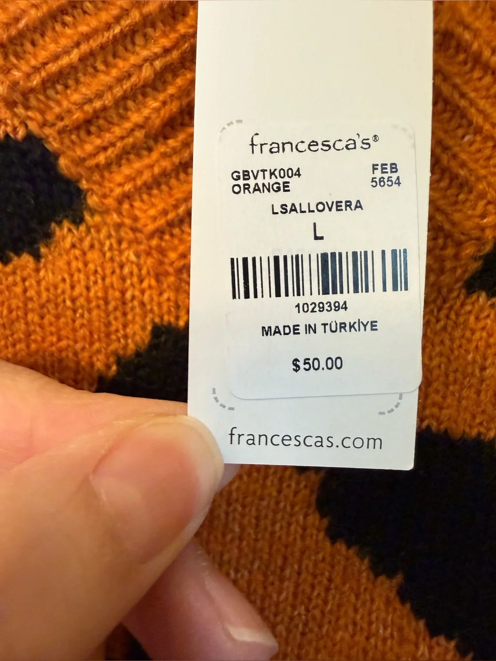 S46 - Francesca's Collections Orange and Black Animal-Print V-Neck Sweater